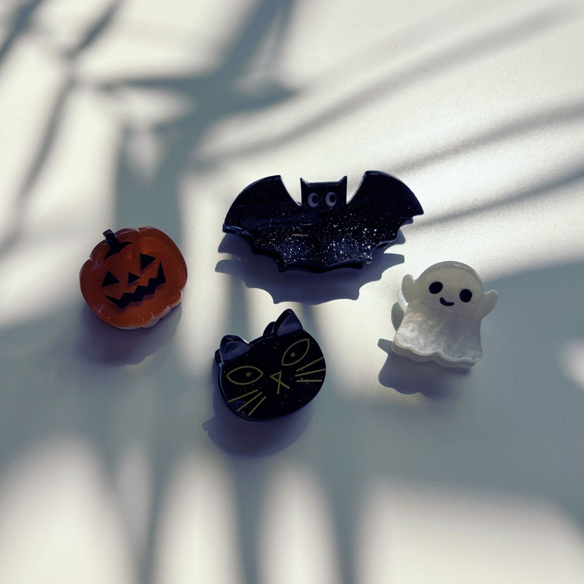 Set of 4 velvet spooky hair claw clips by The Bullish Store, mini claw clips in a giftable pouch, perfect for stylish hair accessories.