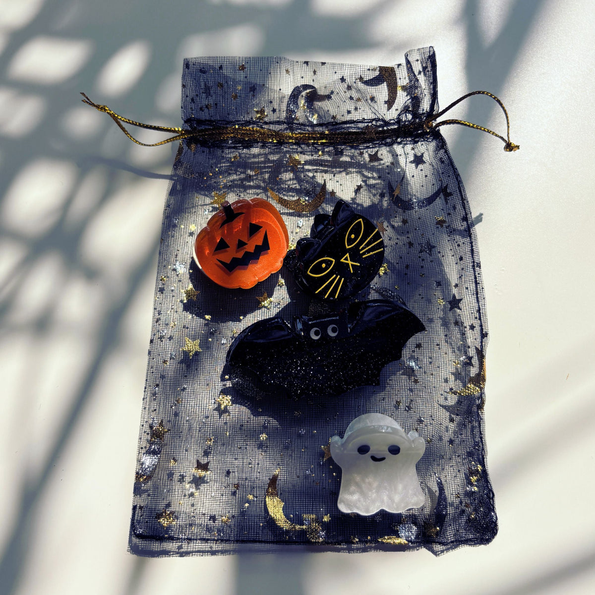 Set of 4 velvet spooky mini hair claw clips from The Bullish Store in a giftable pouch, perfect for stylish hair accessories.
