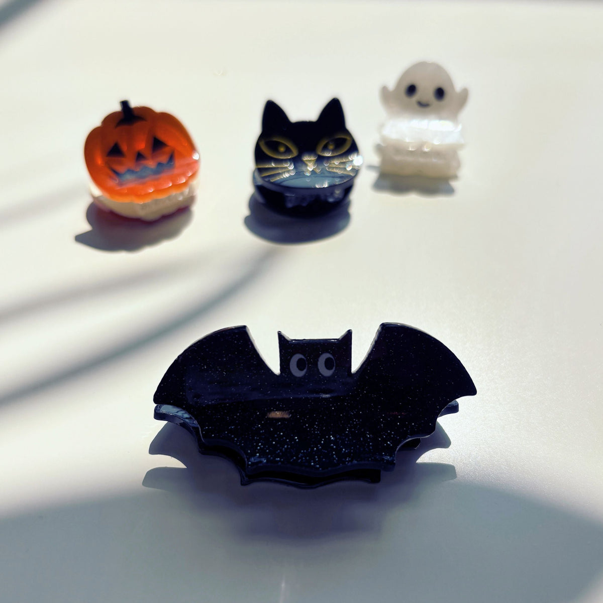 Set of 4 velvet mini spooky hair claw clips from The Bullish Store in a giftable pouch, perfect for stylish hair accessories.
