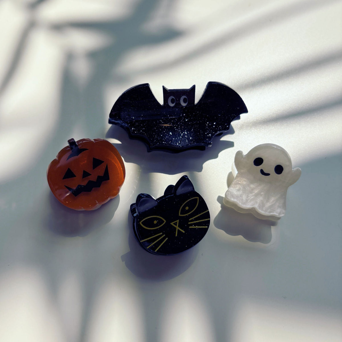 Set of 4 mini velvet spooky hair claw clips from The Bullish Store, shown in a giftable pouch, perfect for stylish hair accessories.