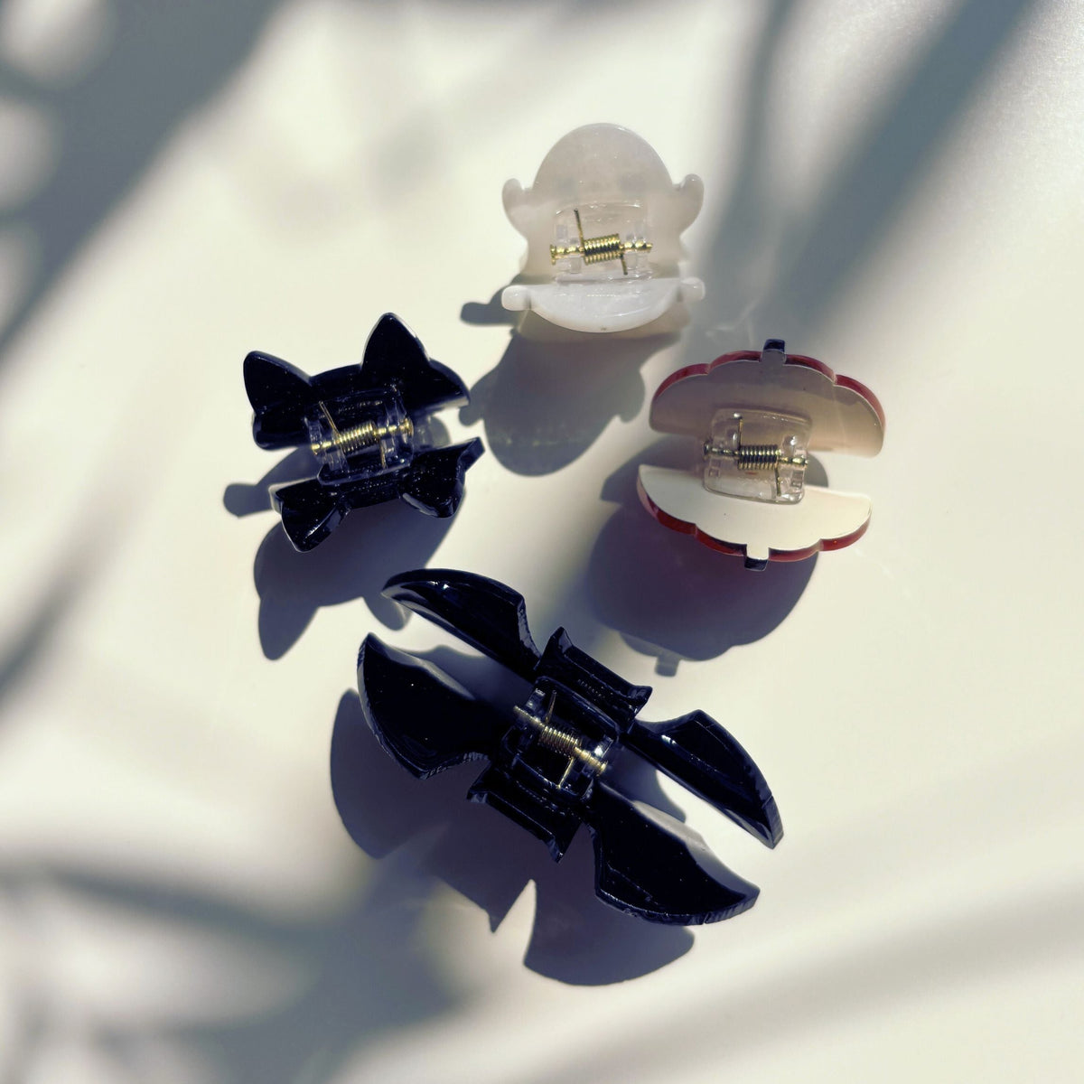 Set of 4 velvet spooky mini hair claw clips from The Bullish Store, perfect for stylish, giftable hair accessories.