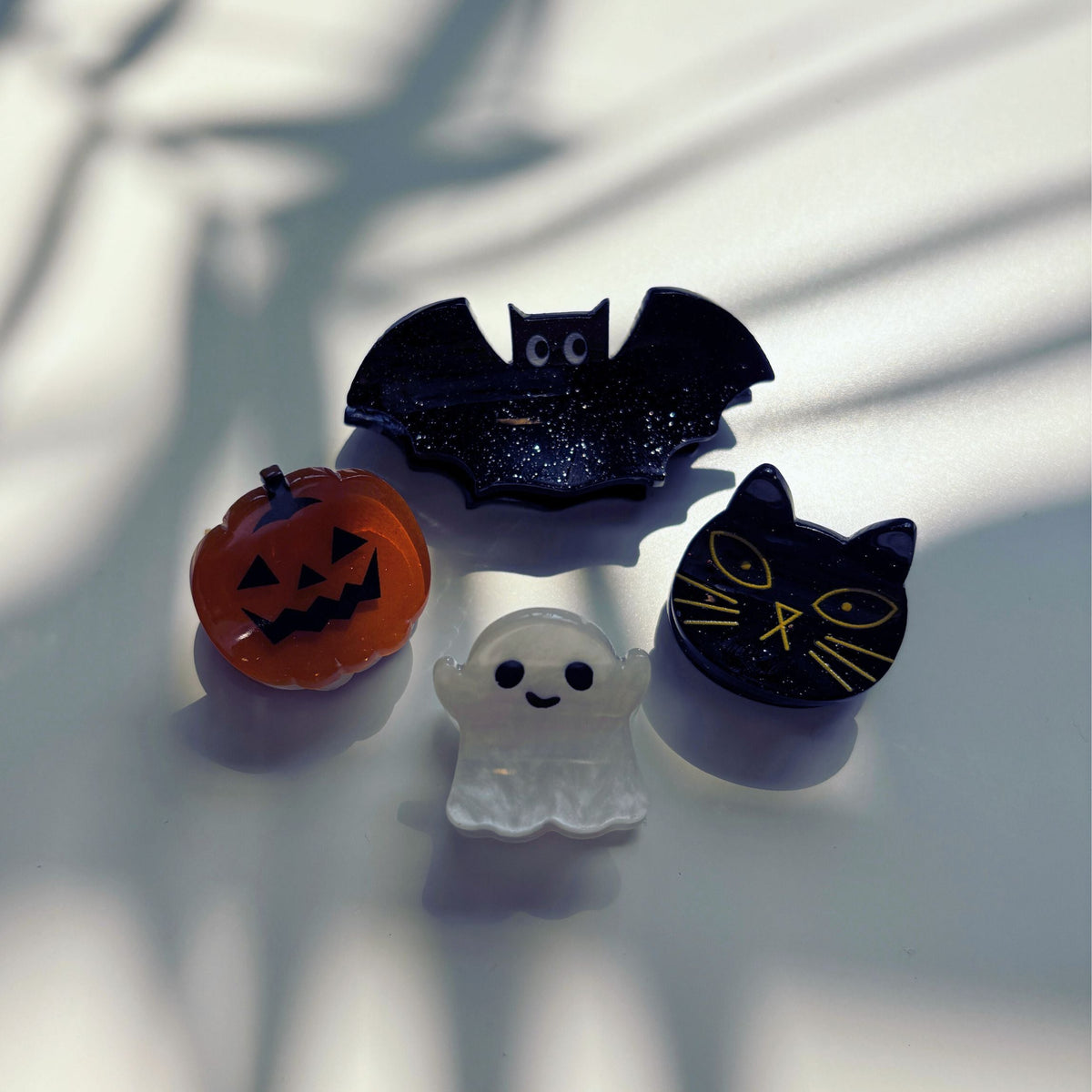 Set of 4 velvet mini spooky hair claw clips from The Bullish Store, shown in a giftable pouch.