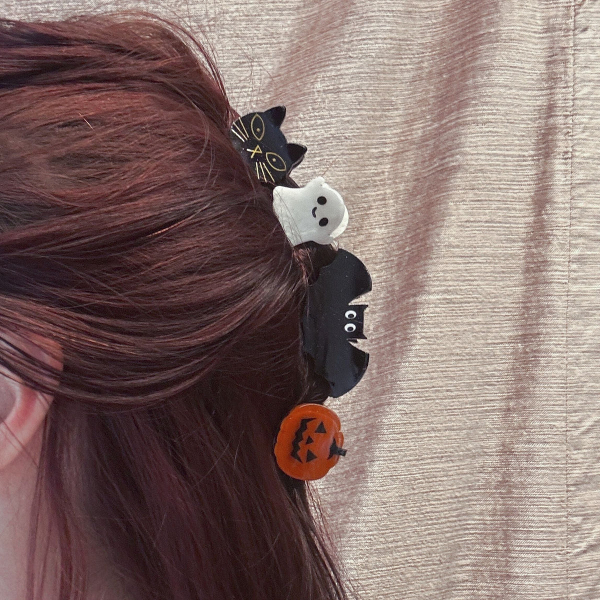 Set of 4 velvet spooky mini hair claw clips from The Bullish Store, shown in a giftable pouch, perfect for stylish hair accessories.