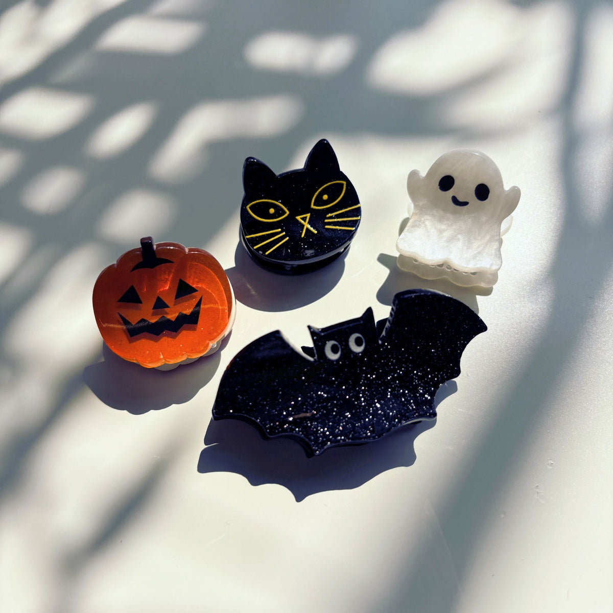 Set of 4 velvet mini spooky hair claw clips by The Bullish Store in a giftable pouch, perfect for stylish hair accessories.