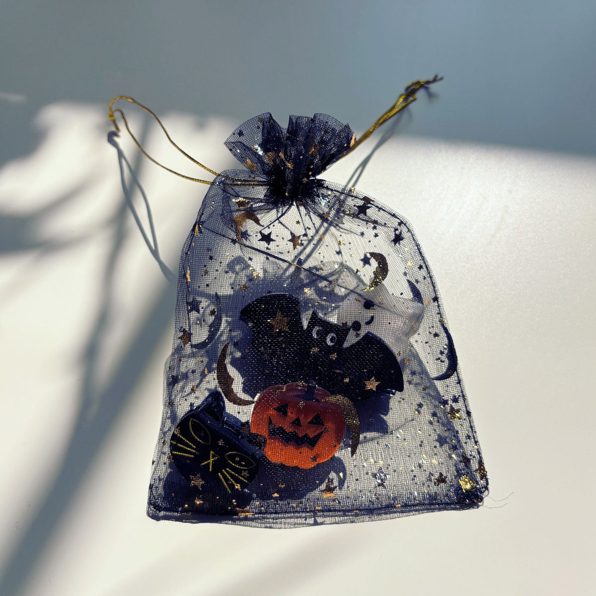 Set of 4 velvet mini spooky hair claw clips from The Bullish Store in a giftable pouch, featuring claw-style hair accessories.