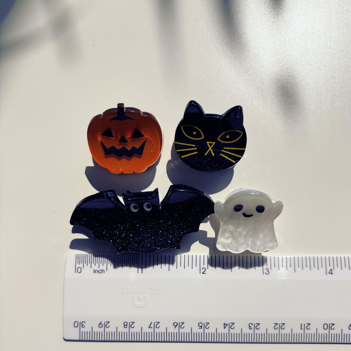Set of four velvet spooky hair claw clips from The Bullish Store, mini claw clips in giftable pouch, ideal for stylish hair accessories.