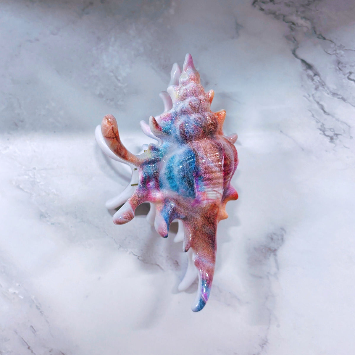 Velvet Claws realistic conch shell hair clip in vibrant mermaid colors, designed by The Bullish Store.