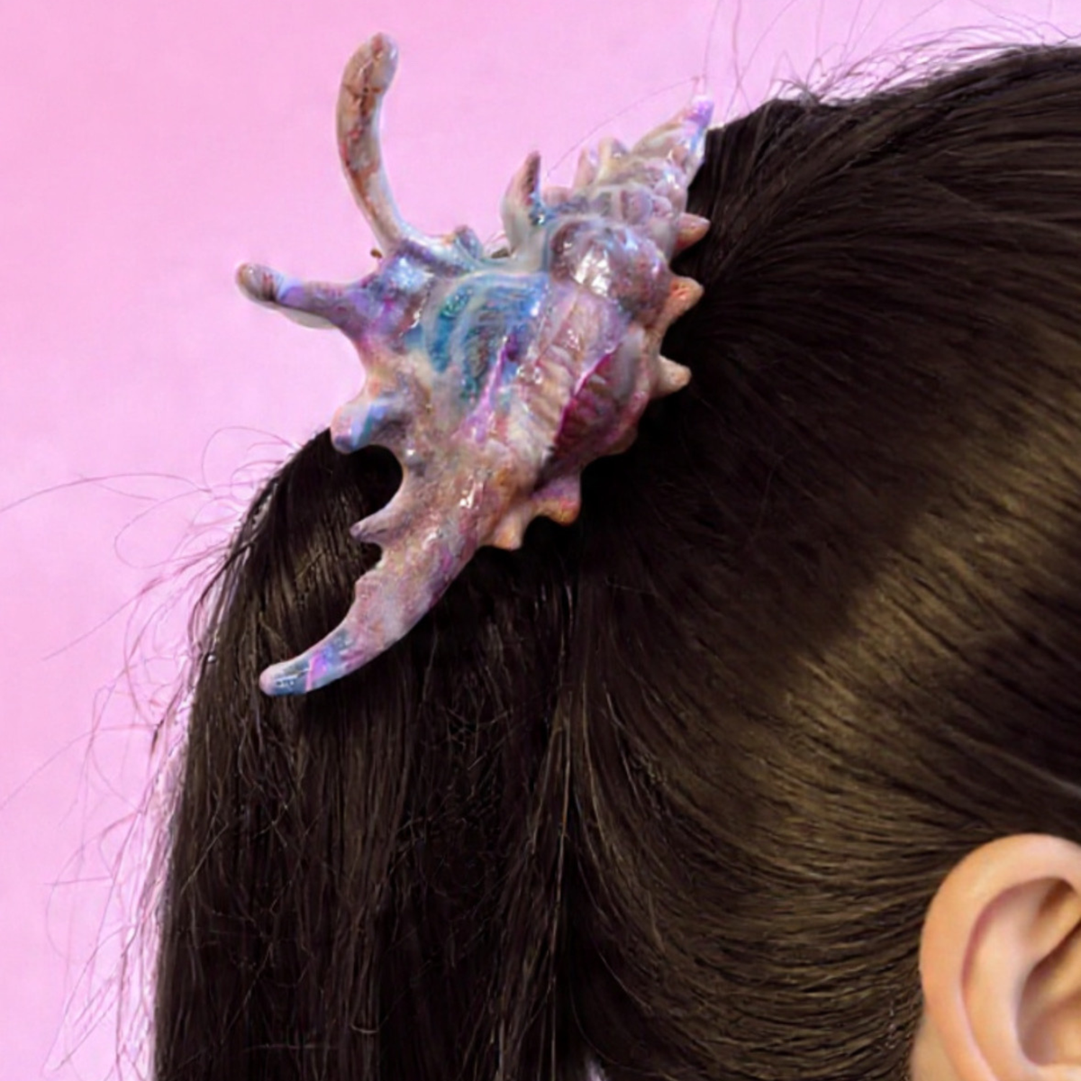 Velvet Claws conch shell hair clip in mermaid colors, realistic design, perfect for stylish hair accessories.