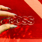 Clear acrylic Boss word keychain with transparent, word-shaped design, perfect for attaching to keys or bags.