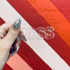 Clear acrylic Boss word keychain from The Bullish Store, transparent and word-shaped keyholder with a durable metal keyring.