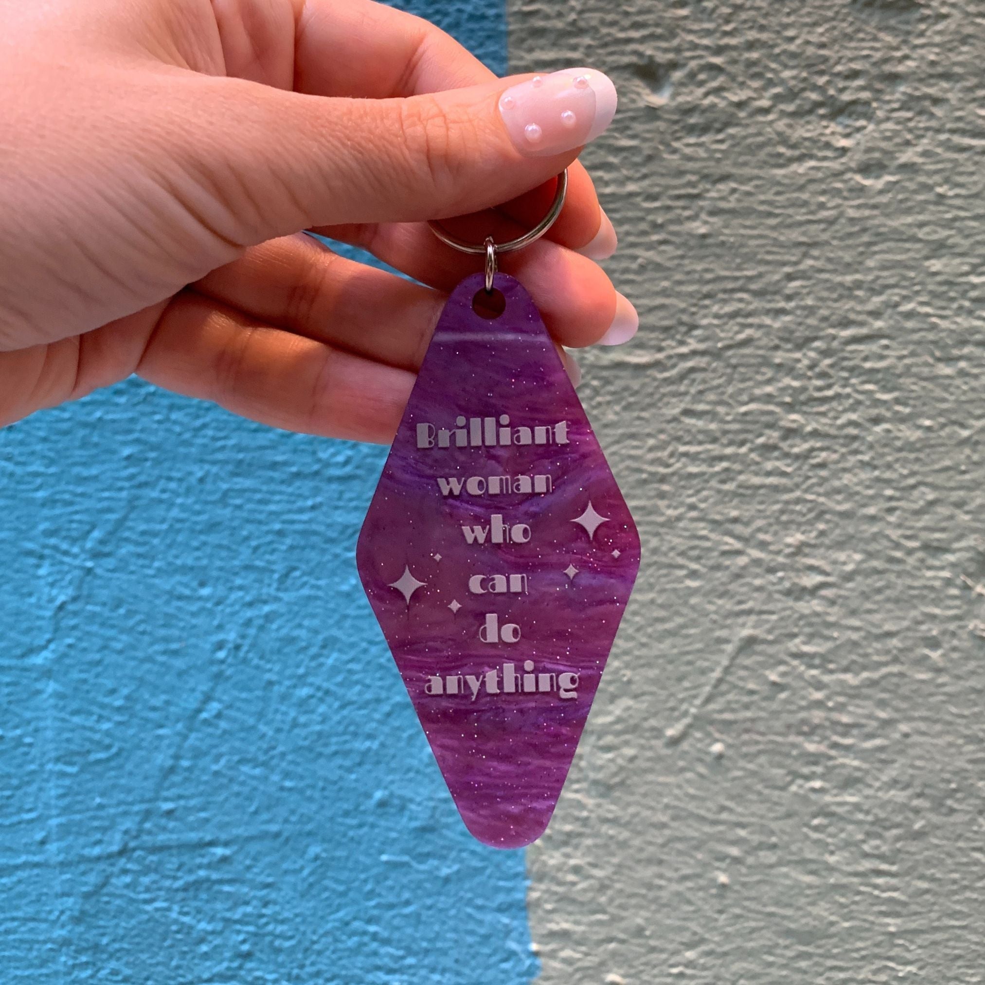Purple marble keychain featuring a "Brilliant Woman Who Can Do Anything" design, from The Bullish Store, ideal as a gift for her.