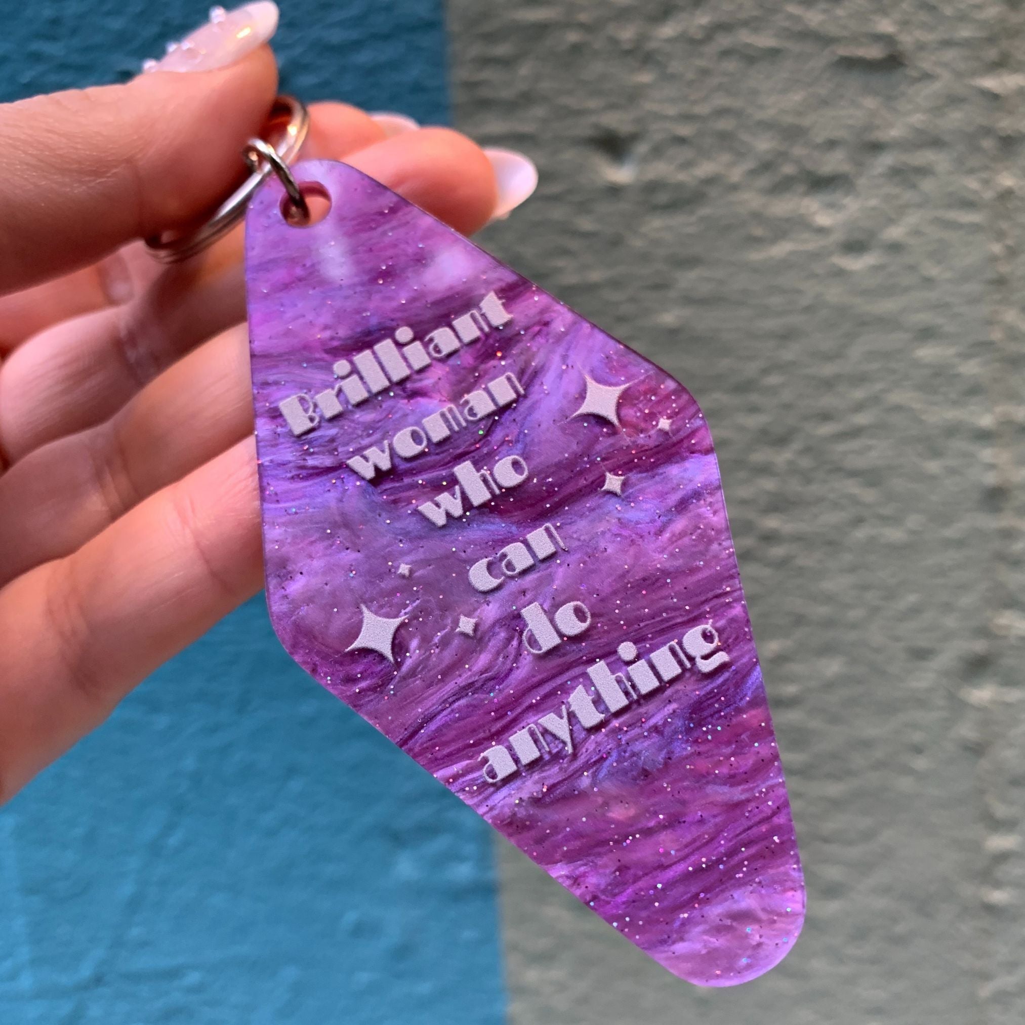 Purple marble keychain featuring a "Brilliant Woman Who Can Do Anything" design from The Bullish Store, ideal for gifting.