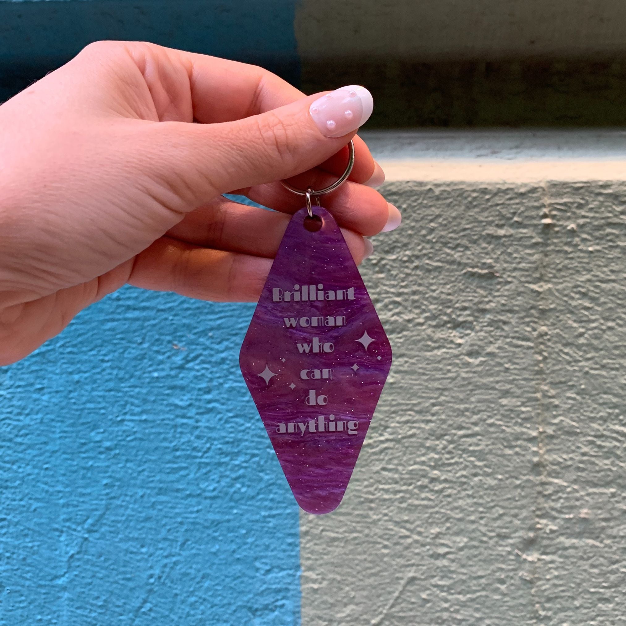 Purple marble keychain featuring a "Brilliant Woman Who Can Do Anything" design from The Bullish Store, ideal for gifting.