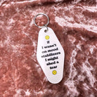 White vintage motel keychain featuring a mood stabilizer design from The Bullish Store, made of durable metal and ideal for keys.