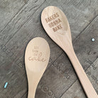 Marie Antoinette inspired wooden cooking spoon from The Bullish Store in muslin gift bag, featuring cute sayings and kitchen utensils.