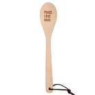 Wooden cooking spoon with "Peace Love Bake" engraving in muslin gift bag, ideal for kitchen utensils and baking accessories.