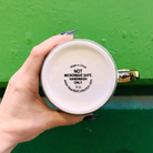 Gold-handle stoneware mug with "Darling You Are A Goddess A Badass" inscription, 15oz capacity, perfect for coffee or tea.