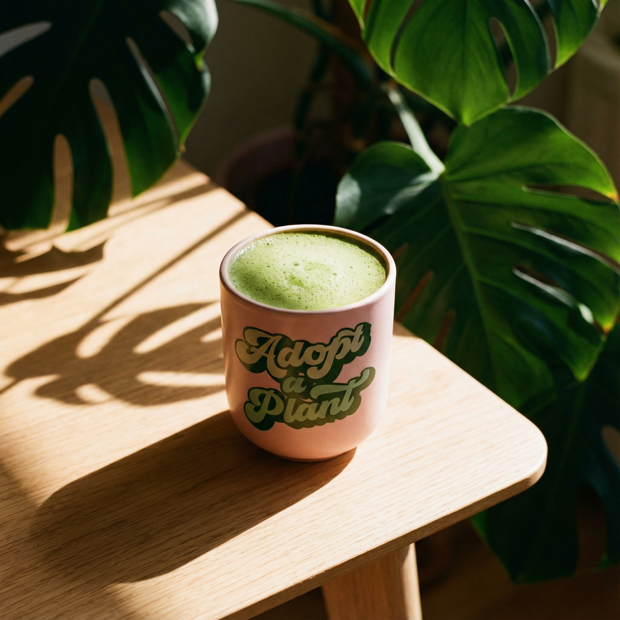 Ceramic to-go mug with plant graphic, 16 oz capacity, silicone lid and sleeve, eco-friendly design from The Bullish Store.