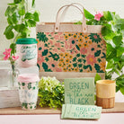 Ceramic adopt-a-plant to-go mug with 16 oz capacity, silicone lid, and sleeve, featuring a plant-themed design from The Bullish Store.