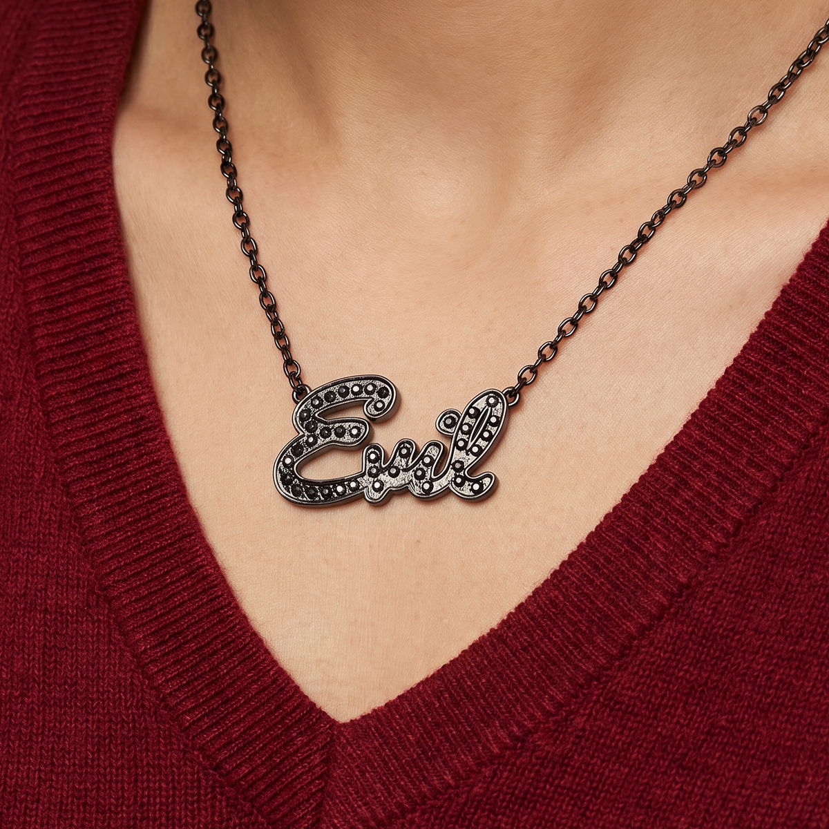 Sourpuss “Evil” pendant necklace with black rhinestones, gothic statement jewelry, featuring a dark, edgy design.