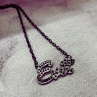 Sourpuss "Evil" pendant necklace with black rhinestones, gothic statement jewelry, featuring a detailed evil-themed design.