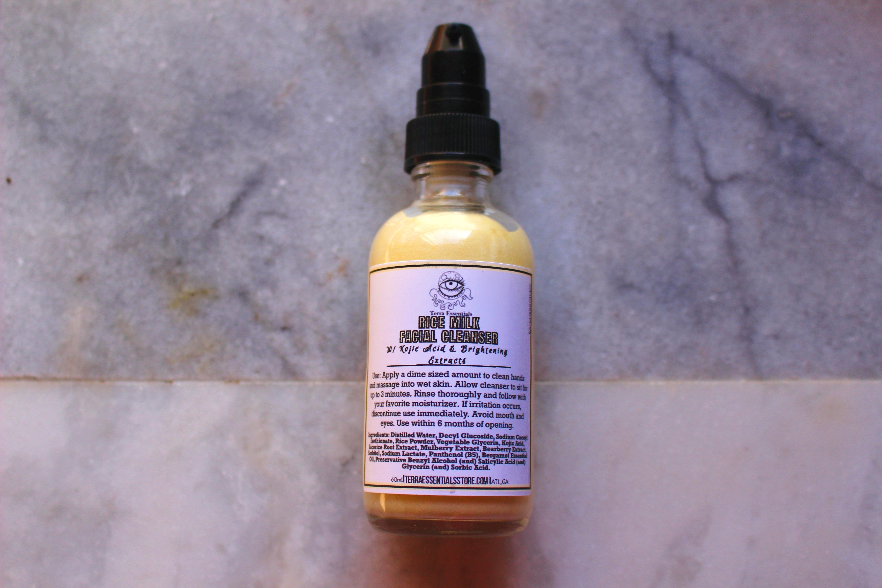 Two-ounce bottle of The Earthly Alternative Rice Milk Facial Cleanser, featuring white and natural packaging with a pump dispenser.