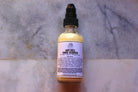 Two-ounce bottle of The Earthly Alternative Rice Milk Facial Cleanser, featuring white and natural packaging with a pump dispenser.