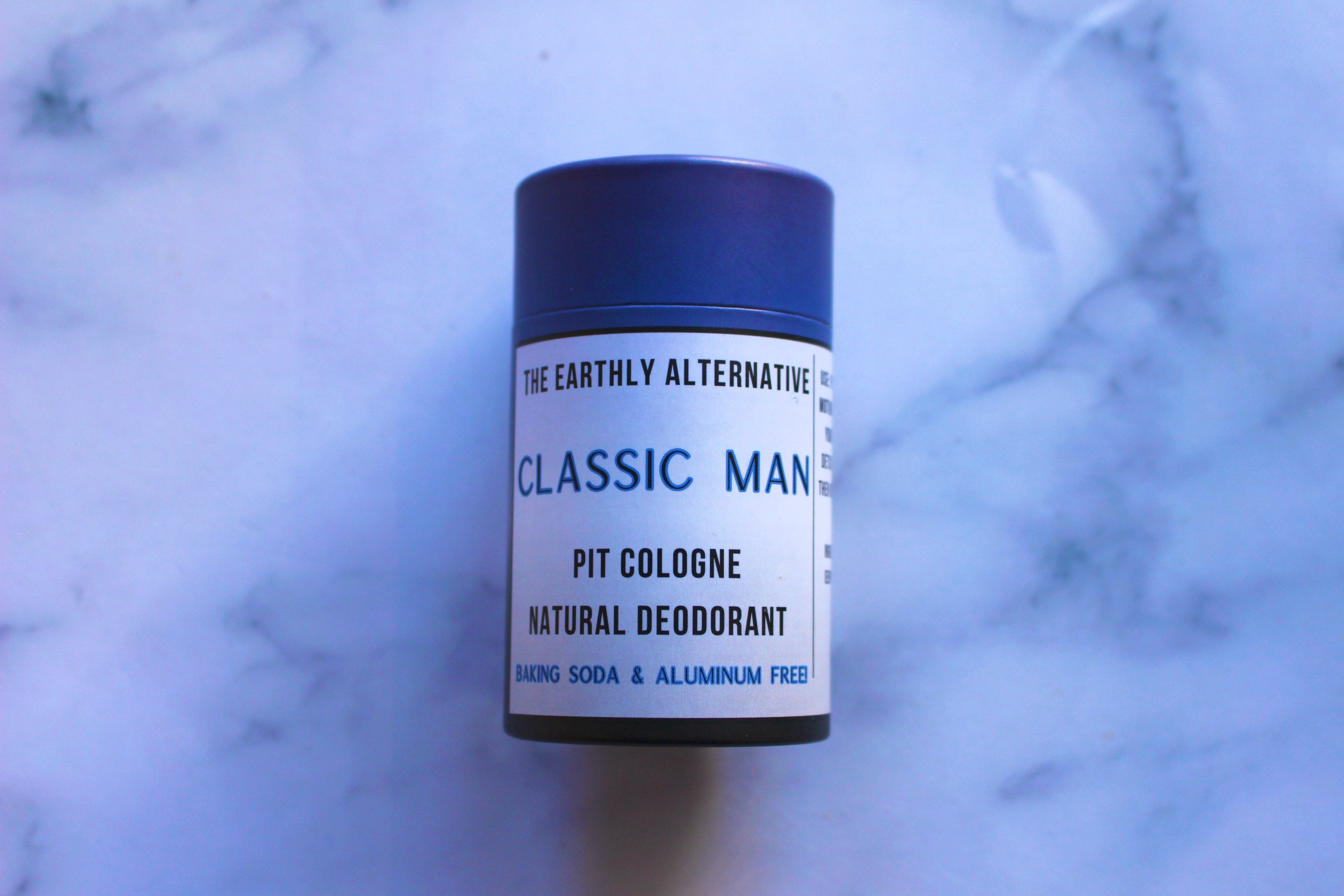The Earthly Alternative Pit Cologne Deodorant for men, featuring a natural stick formula in a sleek container.