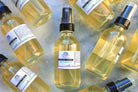 Aloe and green tea facial toner in a clear spray bottle, suitable for skincare, by The Earthly Alternative.