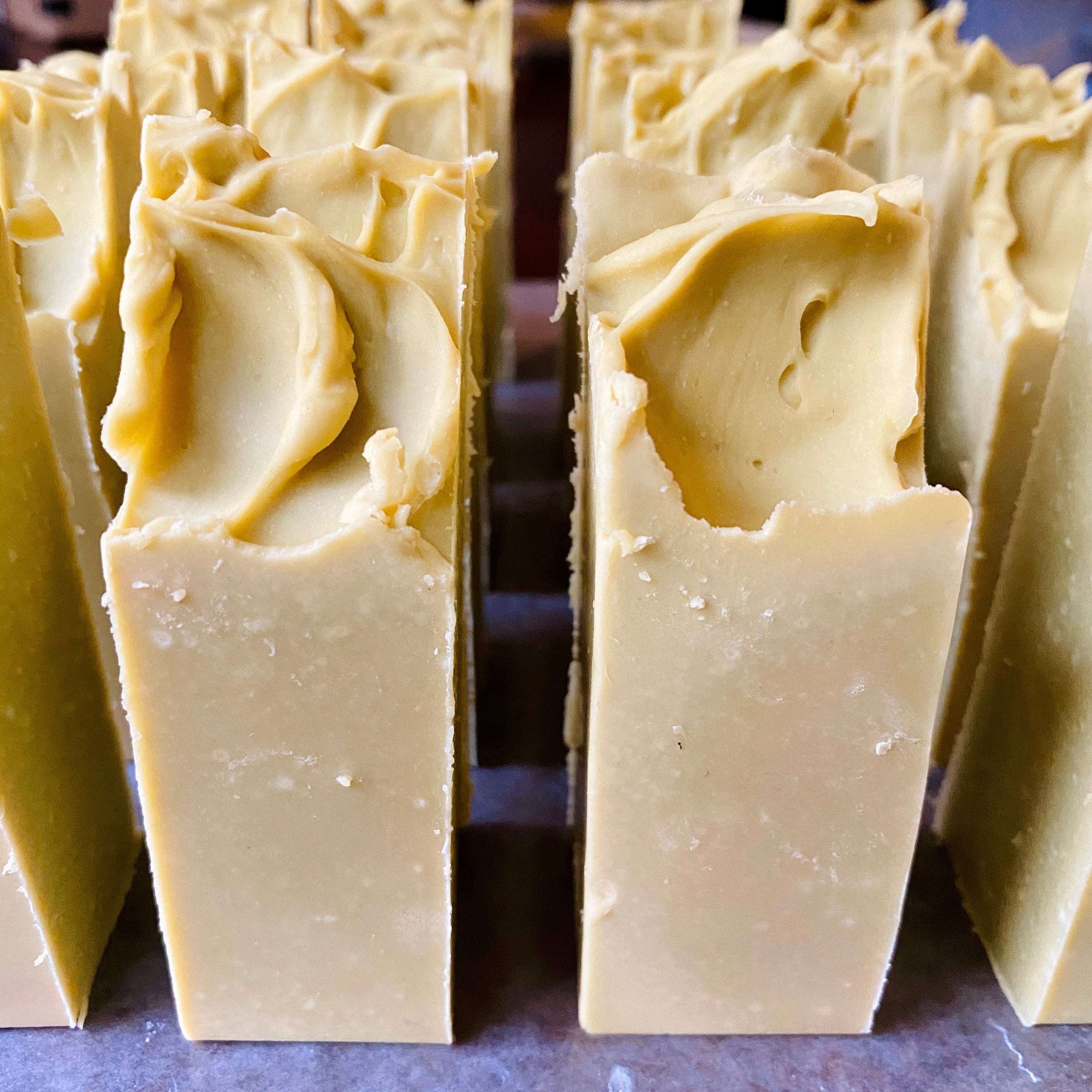 Facial bar from The Earthly Alternative with natural ingredients and a smooth soap texture for cleansing skin.