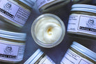 Cream jar labeled "Facial Cream" from The Earthly Alternative, showing a close-up of the skincare product with a smooth, creamy texture.