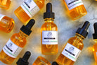 The Earthly Alternative facial oil bottle with dropper, displayed on a neutral background, highlighting natural skincare ingredients.