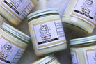 Oat and banana leave-in conditioner from The Earthly Alternative in a clear bottle with a pump dispenser.