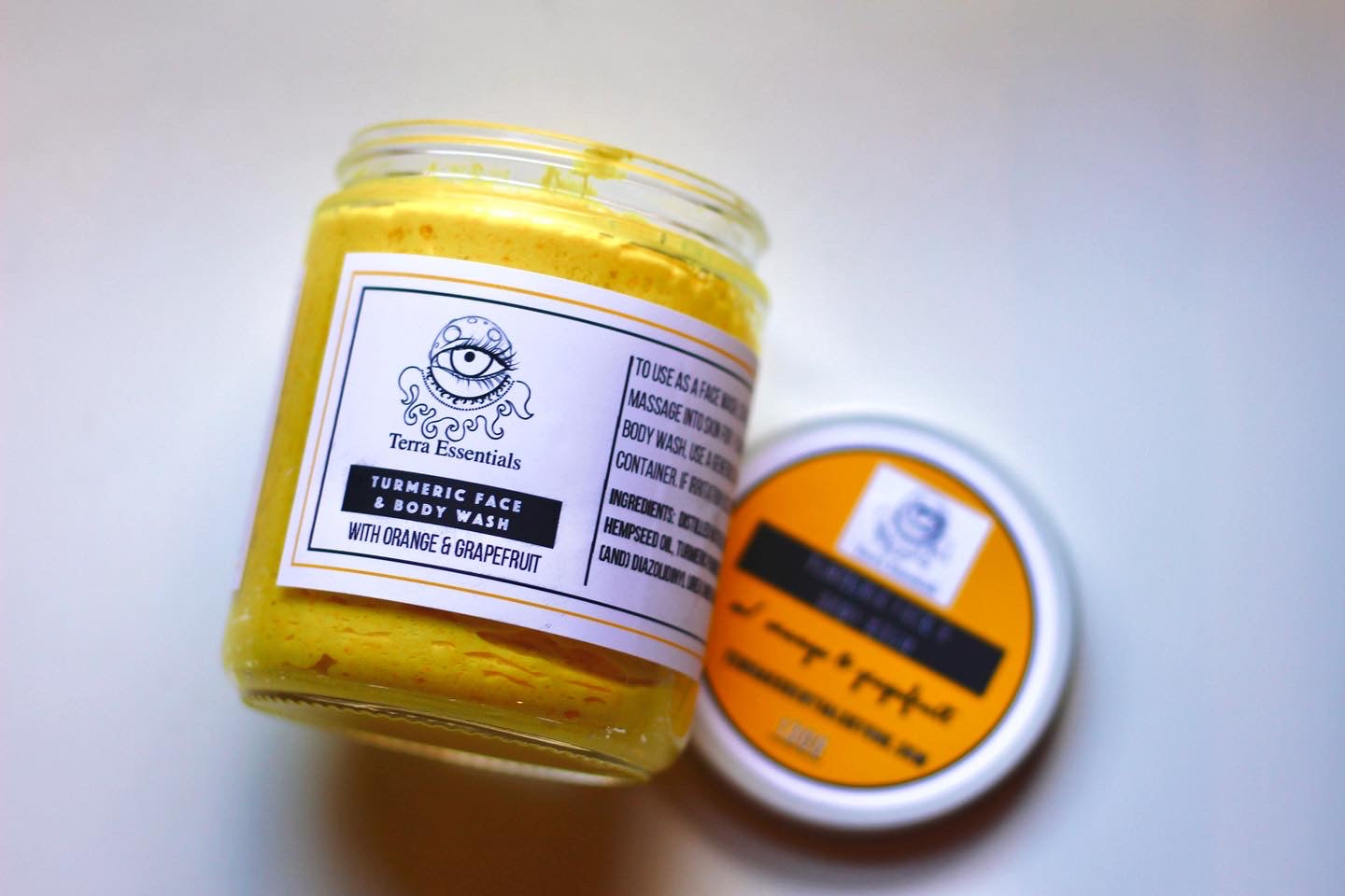 Turmeric Face and Body Wash by The Earthly Alternative with natural ingredients and a gentle cleansing formula.