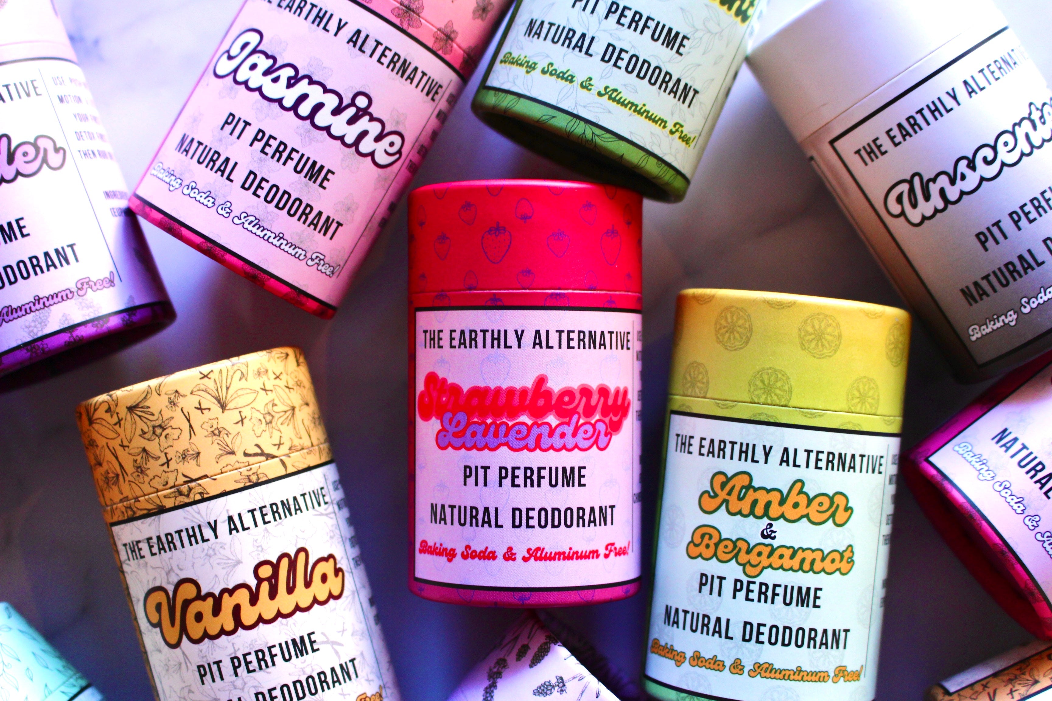The Earthly Alternative Amber Bergamot Pit Perfume Deodorant stick with natural ingredients and fresh citrus scent.