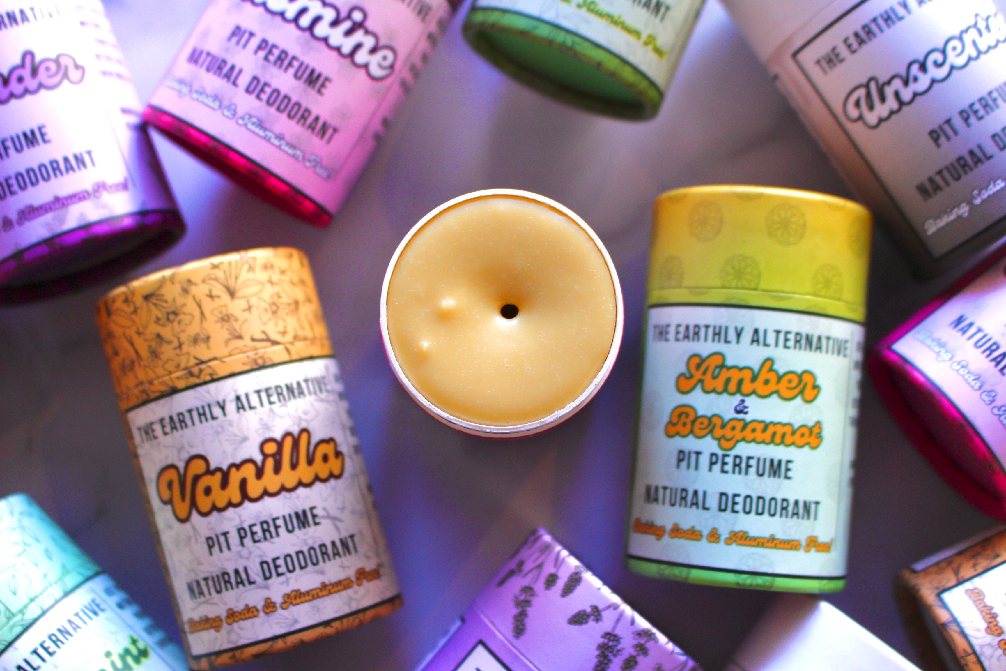 The Earthly Alternative Pit Perfume Deodorant in Amber Bergamot scent, natural deodorant stick for fresh, odor-free underarms.