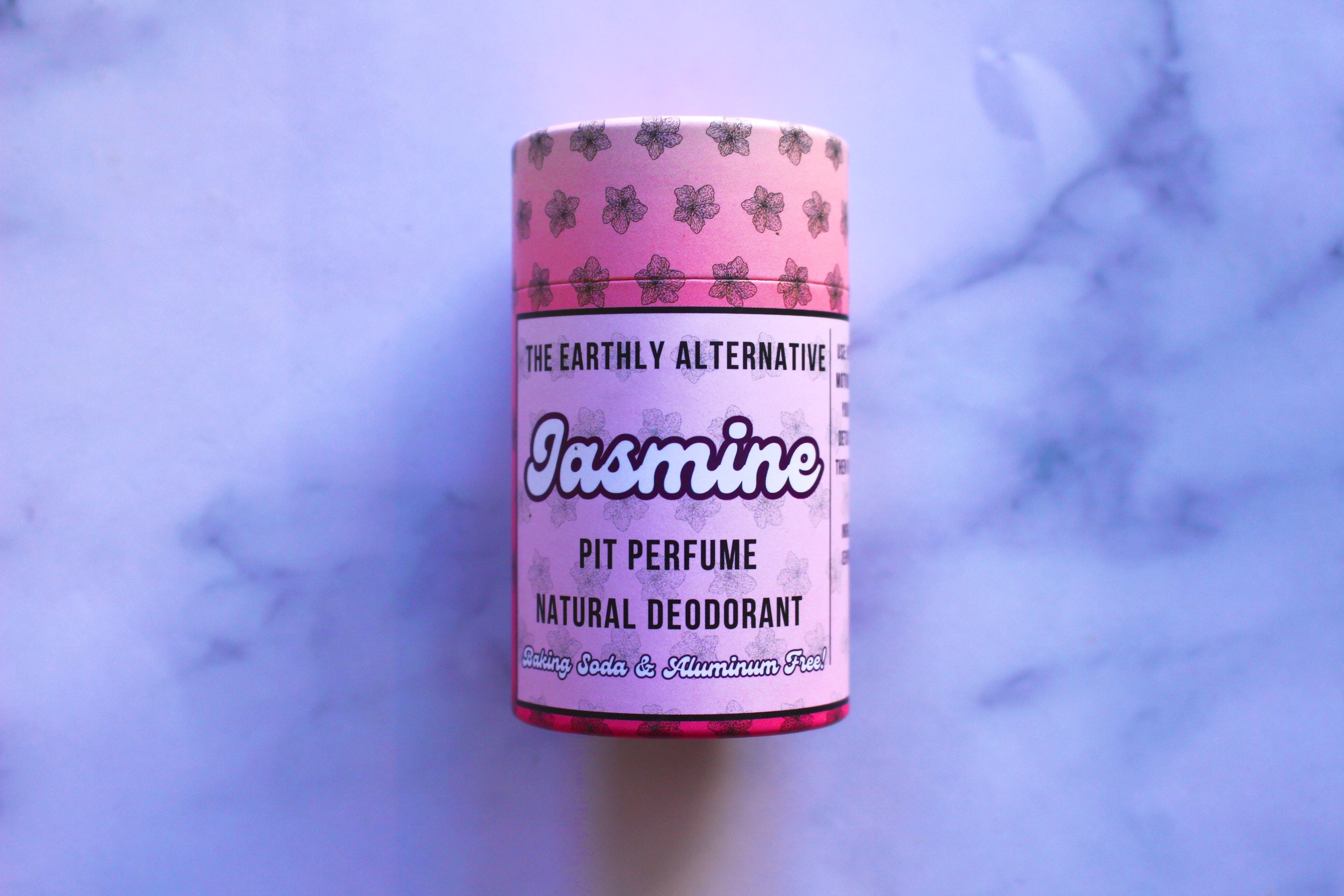 The Earthly Alternative Pit Perfume Deodorant in amber bergamot scent, natural deodorant stick with botanical ingredients.
