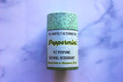 The Earthly Alternative Pit Perfume Deodorant in amber bergamot scent, natural deodorant stick with botanical ingredients.