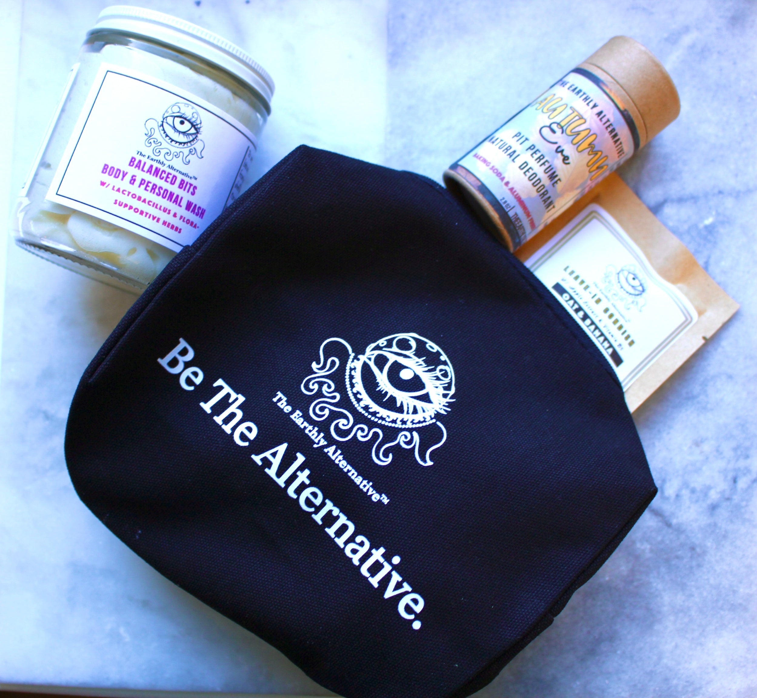The Earthly Alternative deodorant in a travel pouch, featuring natural ingredients and eco-friendly packaging.