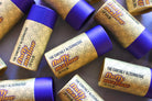 The Earthly Alternative Fluffy Mallow Lip Balm with a soft, fluffy texture in a pastel container, ideal for moisturizing lips.