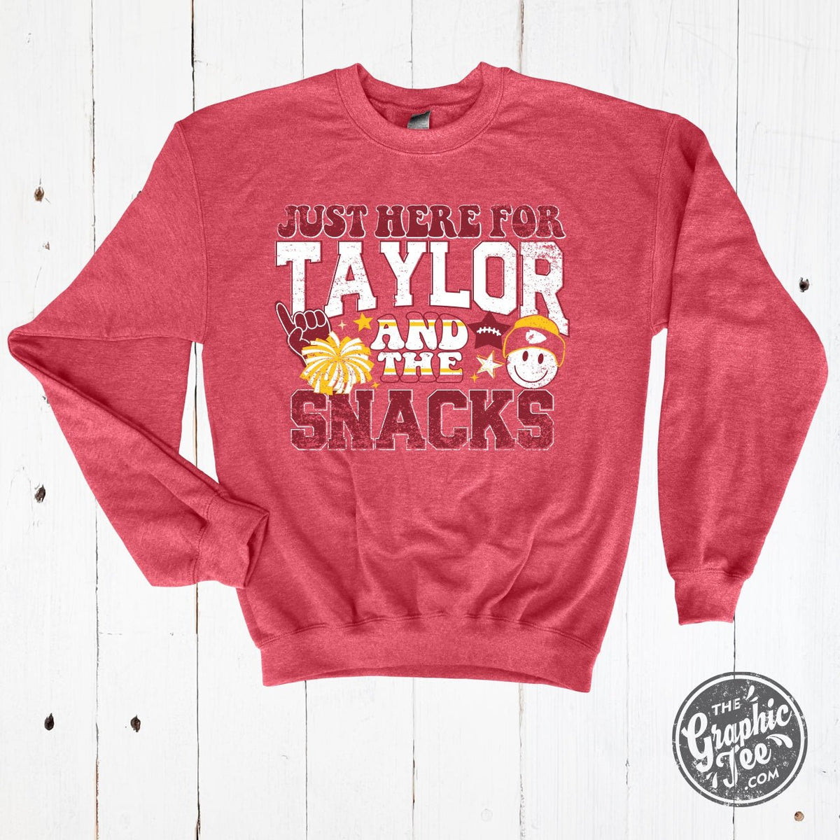 Heather Sport Scarlet crewneck sweatshirt featuring "Just Here For Taylor And The Snacks" graphic, by The Graphic Tee.