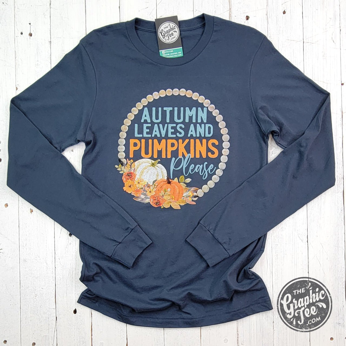 Vintage navy long sleeve tee featuring autumn leaves and pumpkins graphic from The Graphic Tee, casual fall-themed apparel.