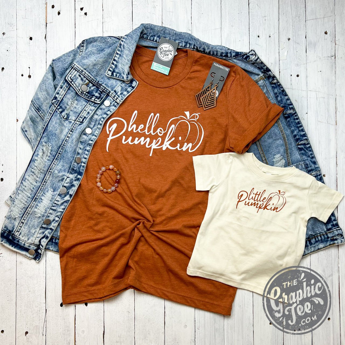 Hello Pumpkin short sleeve graphic tee by The Graphic Tee featuring a festive fall design on a casual t-shirt.