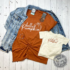 Hello Pumpkin short sleeve graphic tee by The Graphic Tee featuring a festive fall design on a casual t-shirt.