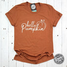 Hello Pumpkin short sleeve graphic tee by The Graphic Tee featuring a festive seasonal design on a casual T-shirt.