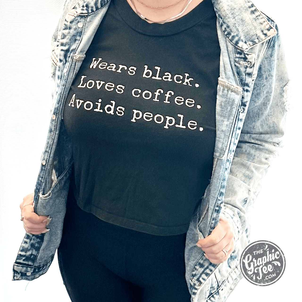 Black short sleeve crop top tee by The Graphic Tee featuring a design with coffee love and social avoidance themes.