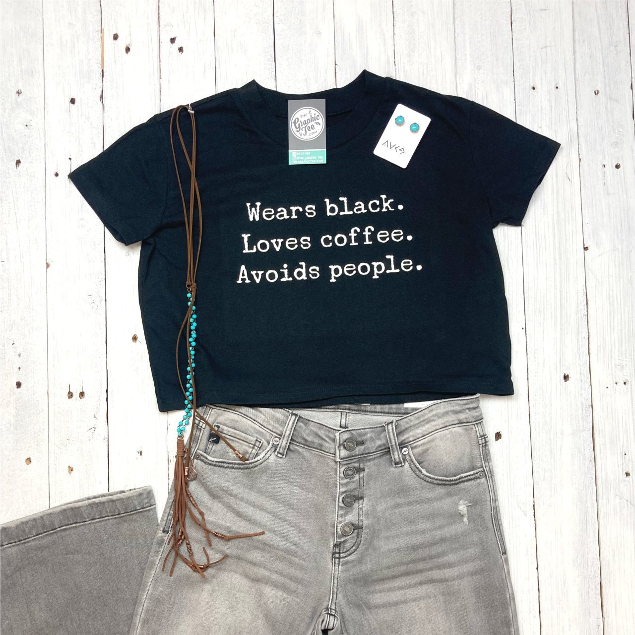 Black short sleeve crop top tee from The Graphic Tee featuring a design for coffee lovers who avoid crowds.