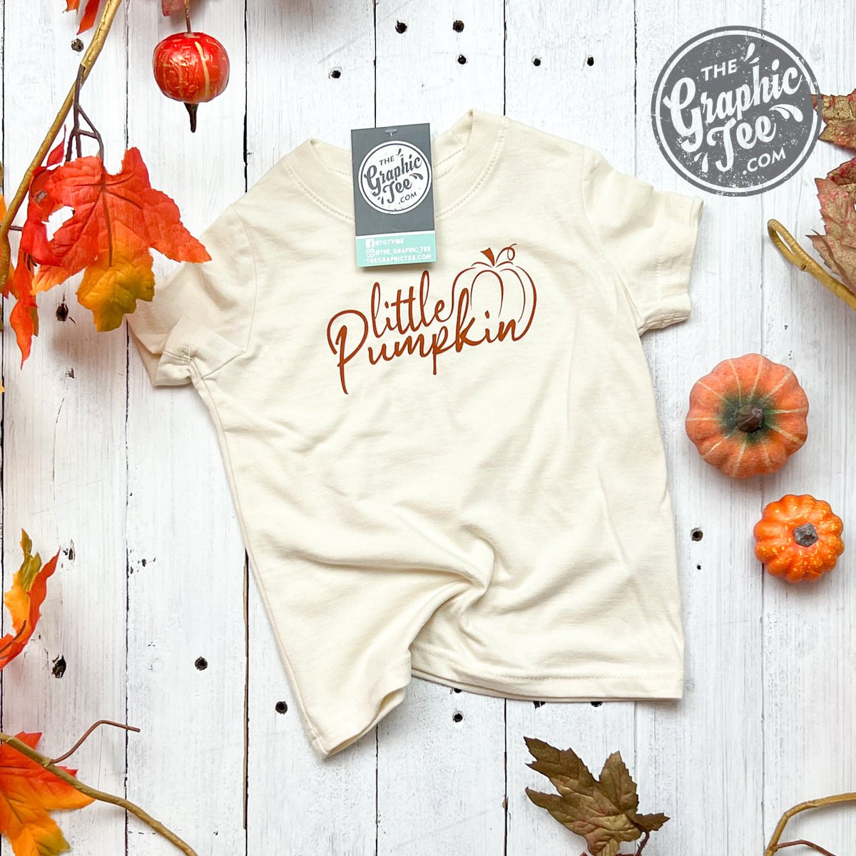 Youth graphic tee featuring a toddler's Little Pumpkin design with short sleeves, from The Graphic Tee brand.