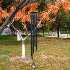 Large deep tone wind chime by The Wind Chime Co featuring church bells, perfect for memorials or reflective moments, 55 inches tall.