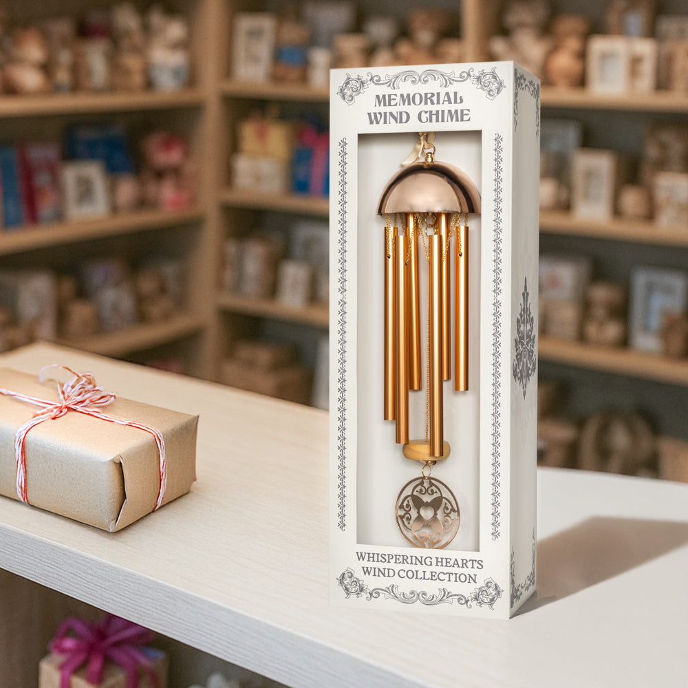 Warm gold memorial wind chime from the Whispering Hearts™ Collection by The Wind Chime Co, 15-inch with metal tubes and decorative heart accents.